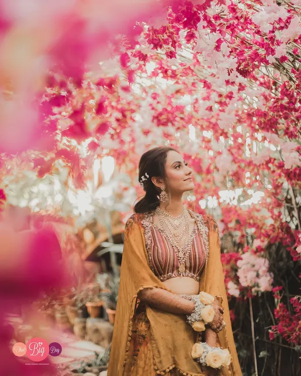 A bride framed by blossoms, looking towards her future. Our bridal portrait sessions are about more than just a beautiful photo; they are about capturing the soul of the woman at the heart of the story.