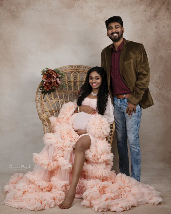 A beautiful family portrait in the making. This couple looks radiant and happy as they prepare to welcome their new addition.