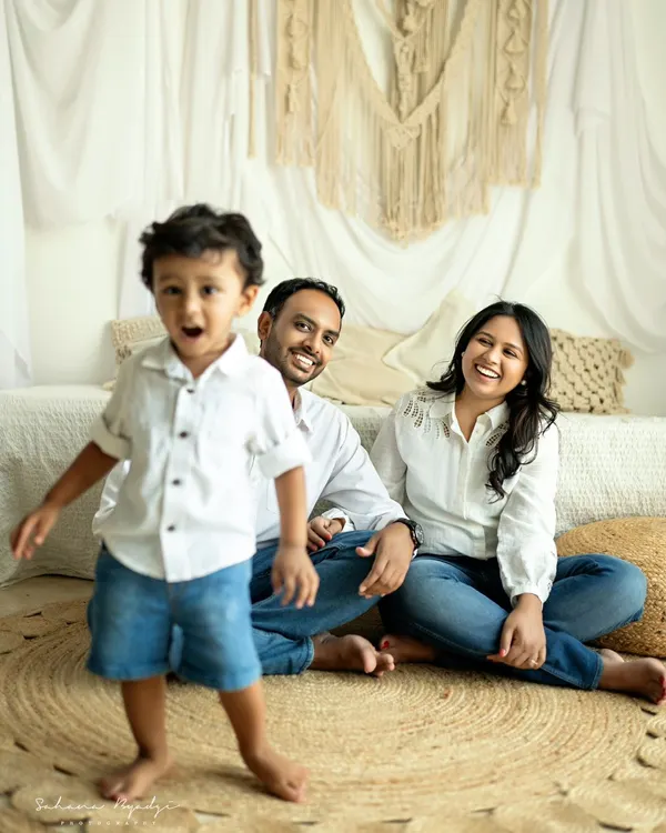 This little boy is the center of his parents' world, and his energetic presence brings so much joy to the photo. I love capturing these unposed moments where the family is just enjoying each other.