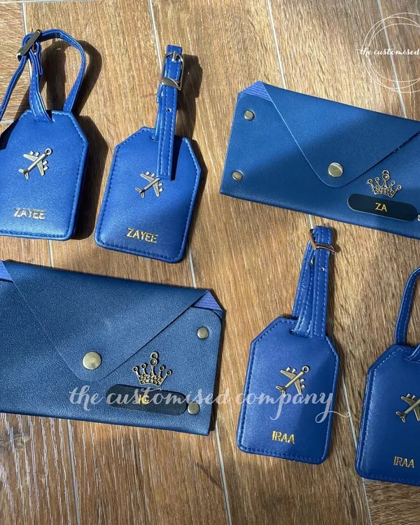 For the jetsetter, the honeymooner, or the weekend explorer. This coordinated travel set in royal blue includes personalized passport wallets and luggage tags, marrying function and flair.