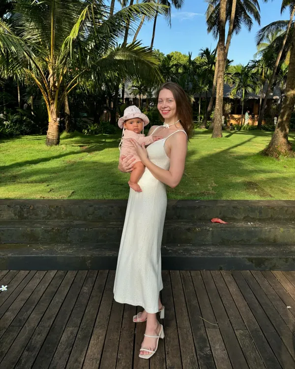 Holding my daughter, Emi. I used to see motherhood as an obstacle to my practice and travels, but now I only want to share this beautiful world with her.