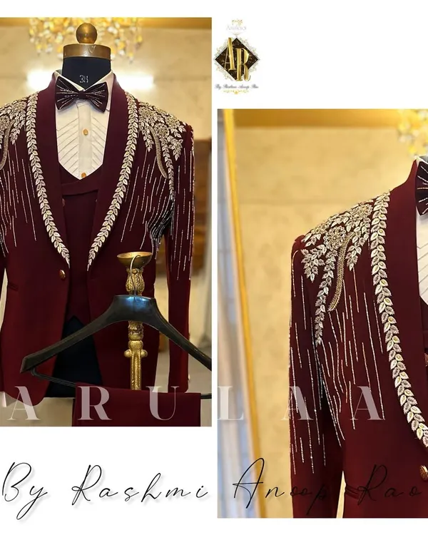 This bespoke maroon tuxedo is what I call a showstopper, perfect for a grand reception. I designed this for a groom in the UAE, focusing on creating a royal look with intricate hand embroidery using zardosi, saadi, and crystals that cascade down the shoulders. The three-piece construction ensures a sharp, structured fit that feels as good as it looks.