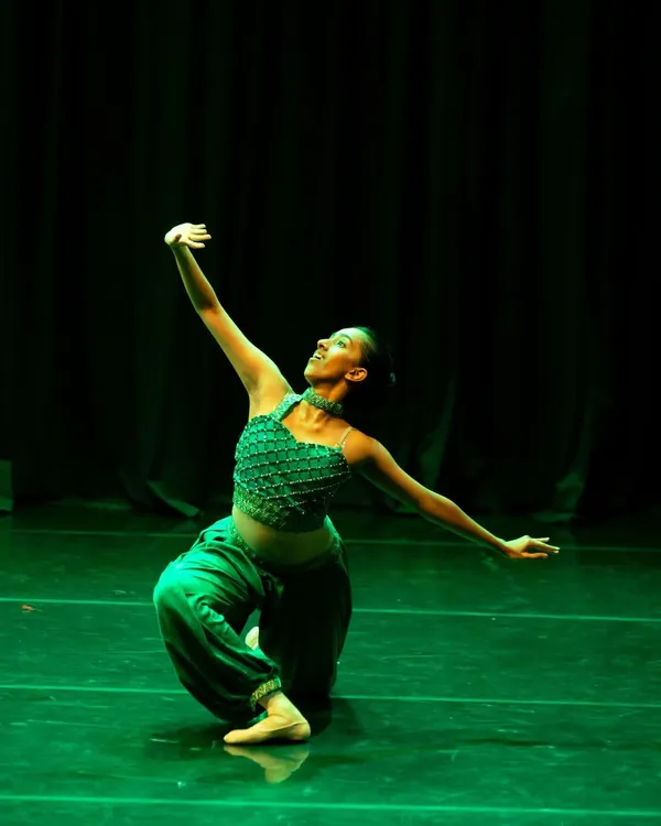 A striking solo moment from a rehearsal for our "Aladdin" production. This image captures the magic and character of the Emerald from the Cave of Wonders.