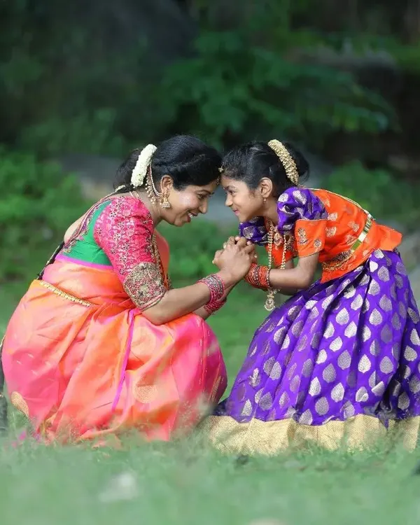 This is what makes my work so special. I had the honor of designing this coordinated mother-daughter set, creating a beautiful memory for this lovely family. The way they look at each other is just everything.
