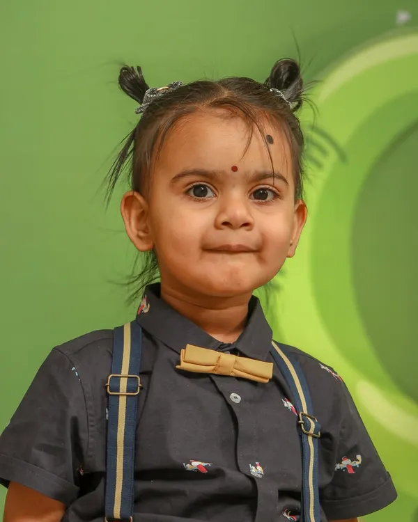 A sharp, vibrant portrait of a little girl at her birthday party. I focus on capturing the fun and personality of children during their special events.