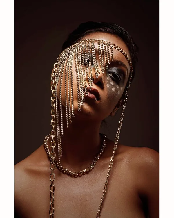 This is a conceptual piece where I explored the idea of being both seen and unseen. The cascading chains create a veil, transforming a simple portrait into a high-fashion statement, perfect for an editorial or avant-garde portfolio.