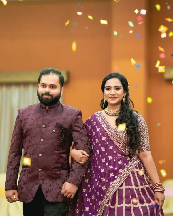 The grand entrance of the couple at their engagement function, showered with confetti. We capture the celebratory atmosphere and excitement of this key moment.