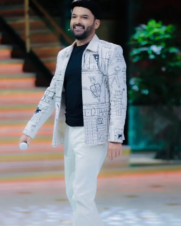 This was a dream project. I collaborated with designers Jayesh and Kajal Shah to create this custom hand-painted outfit for the one and only Kapil Sharma. The design features robotics and abstract puzzle themes, which I meticulously detailed to create a piece full of character for "The Great Indian Kapil Show".