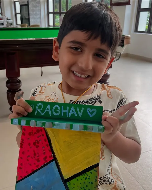A happy student with the personalized nameplate he created as a gift. Handmade presents are the best!