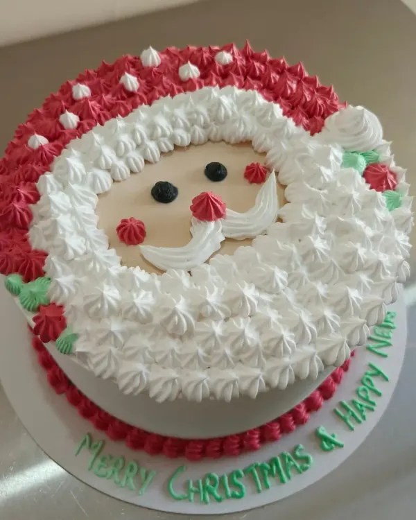 Here is another look at my popular Santa Claus themed cake. I can customize the message on the board, like this one wishing a "Merry Christmas & Happy New Year".