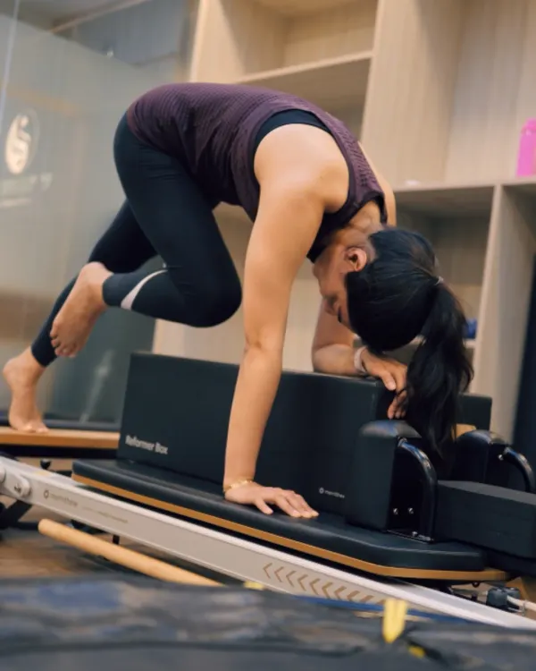 This mountain climber variation on the Reformer is an intense core challenge. It requires stability through the shoulders and abs while the legs are in motion, building functional strength.