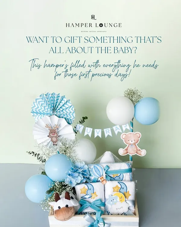 Looking to gift something that’s all about the new baby? This hamper for baby Yuvraj is filled with newborn must-haves, including soft towels, adorable toys, and festive balloons, all in a classic blue and white theme.