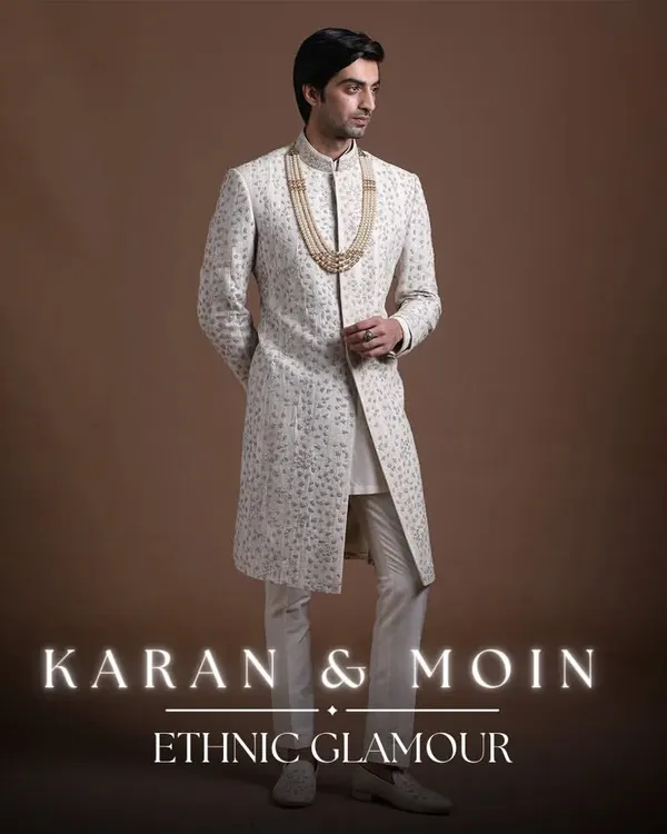 This ivory sherwani is the epitome of ethnic glamour. It blends Western tailoring for a clean silhouette with traditional fabrics and intricate handwork, offering a modern fusion of comfort and elegance for the groom.