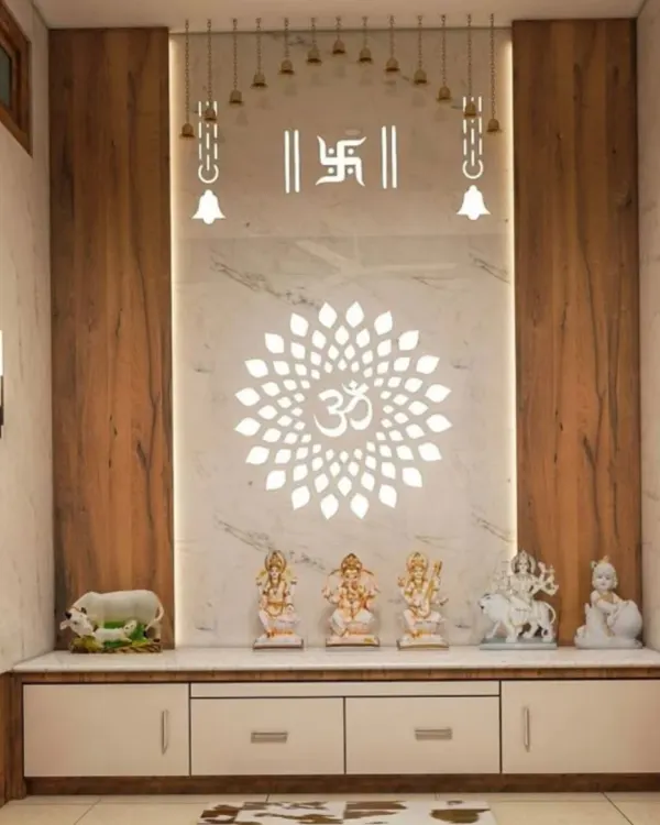 This modern pooja unit is defined by its striking backlit Om mandala and Swastik symbols. The gentle light creates a peaceful ambiance, beautifully complementing the white marble finish and warm wood side panels.