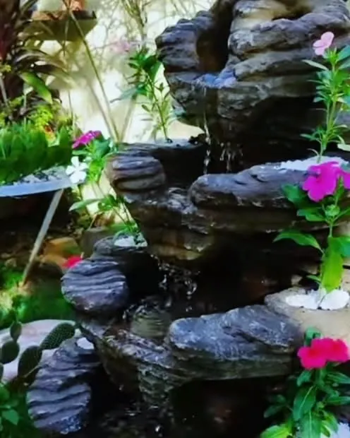 A close up of a small rock waterfall we installed. The sound of flowing water adds a very calming feeling to any garden, big or small.