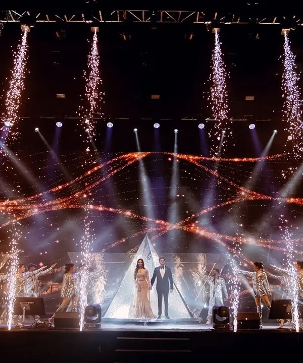This is what I call a statement entry. For this sangeet, I combined a massive LED backdrop with perfectly timed pyrotechnics and a troupe of dancers in reflective costumes to create a truly blockbuster reveal for the couple.