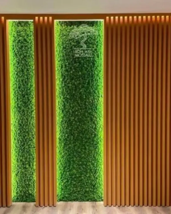 A glimpse into the modern office spaces I create. This stylish partition wall combines wooden fluted panels with backlit artificial green panels to make a bold statement in the reception area. This is the kind of factory finish quality I deliver for my commercial interior projects.