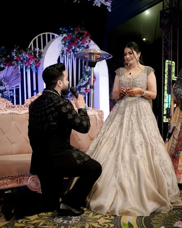 The classic proposal moment. We capture the groom on one knee during the ring ceremony, a pinnacle of romance and commitment.
