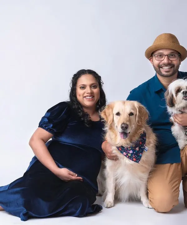 A perfect family portrait before the new baby arrives, with two very happy dogs. I welcome pets in my studio and know how to make them feel comfortable for a fun and memorable maternity photoshoot.