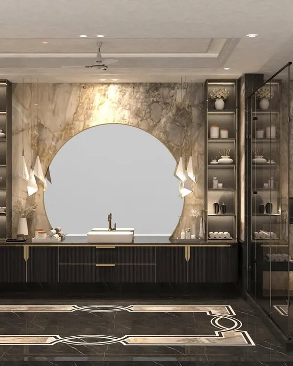 Elevating everyday moments with the timeless elegance of stone. This expansive bathroom features a massive circular mirror, dual vanities, glass-fronted storage, and beautiful floor-to-ceiling marble.