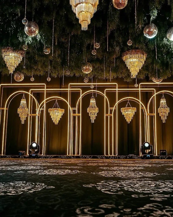 POV: You walked into the party and thought it was a high-fashion gala. We live for this drama, blending architectural lighting with hanging chandeliers and disco balls to create a truly immersive, unforgettable sangeet or reception night.