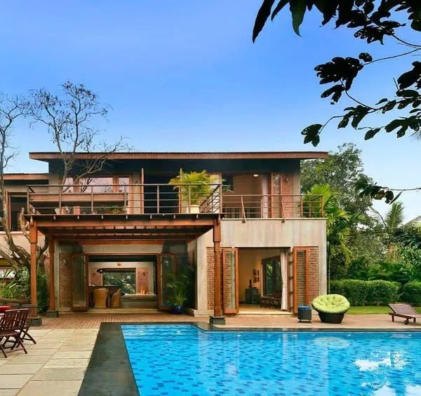 The 5 Element House, designed as a home for celebrating life with family and friends. The architecture, with its infinity pool overlooking Pavna Lake, lives in harmony with the elements of earth, sky, air, and water.