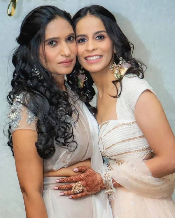 A beautiful moment between two clients. I created coordinated subtle glam looks for them, focusing on soft curls and makeup that feels light and looks effortlessly elegant.
