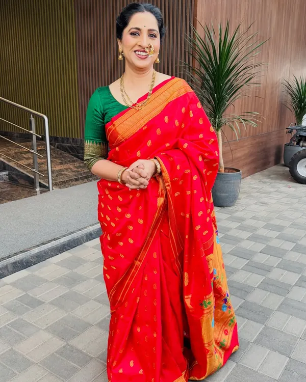 A full-length shot of the lovely actress Madhurani Prabhulkar in a classic red Paithani saree. I created a timeless look with a simple bun and traditional jewelry.