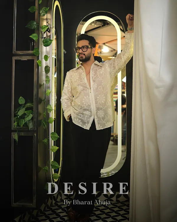 Transparency with intention. I designed this sheer white shirt with delicate floral embroidery for a look that is both confident and sophisticated. It is about showing strength in a subtle way.