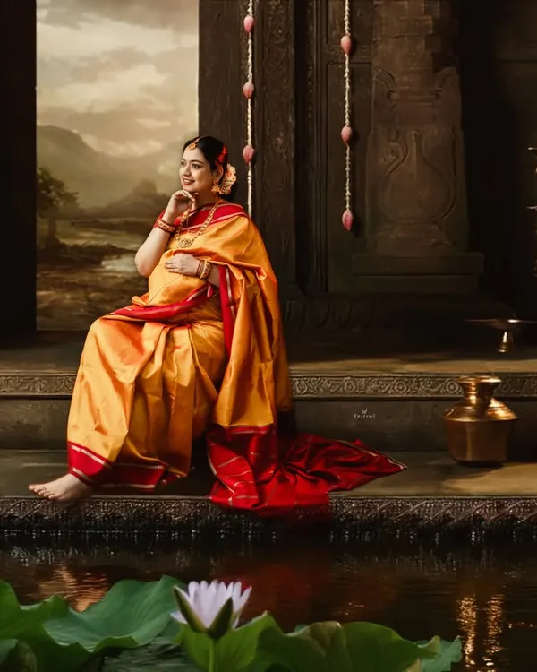 This is the kind of magic we create in the studio. A serene, temple-inspired setting for a mom-to-be, capturing the divine feeling of this special time in a rich, traditional silk saree.