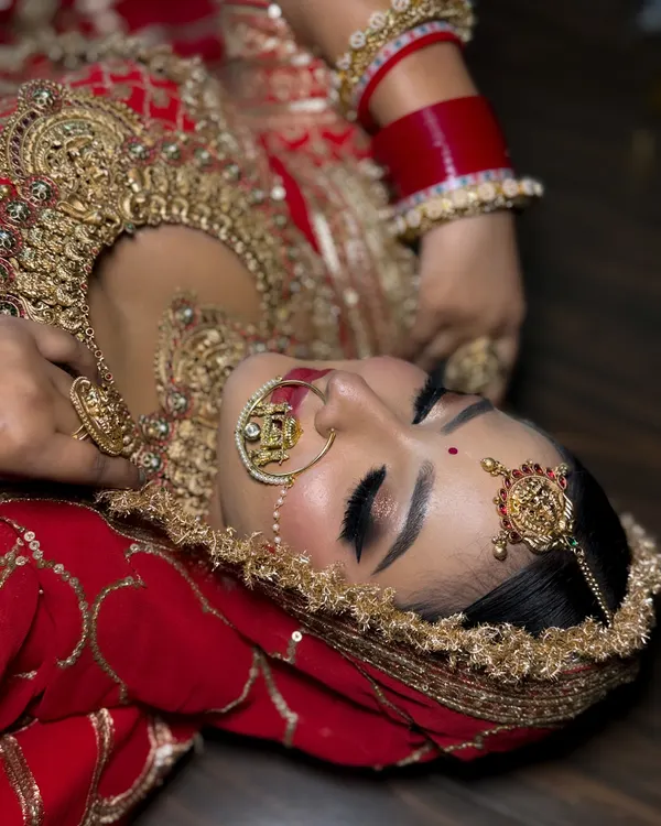 For me, bridal makeup is an art form. This shot captures the intricate details of a classic bridal look, focusing on the flawless, glowing skin and dramatic eye makeup that will last through a long day of celebrations.