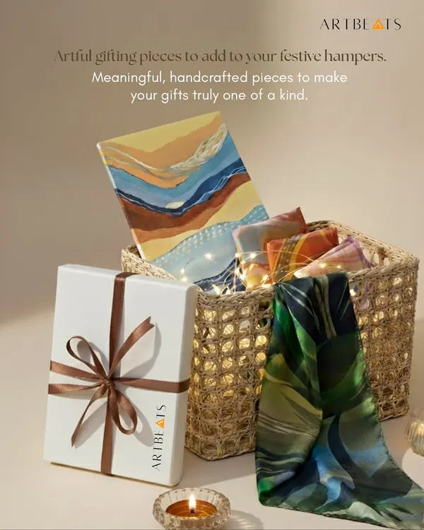 This is what a thoughtful gift looks like. I assemble each hamper with care, combining items like original small artworks and luxurious printed scarves. It’s more than a corporate gift; it’s a curated experience, presented in our signature packaging to make a lasting impression.
