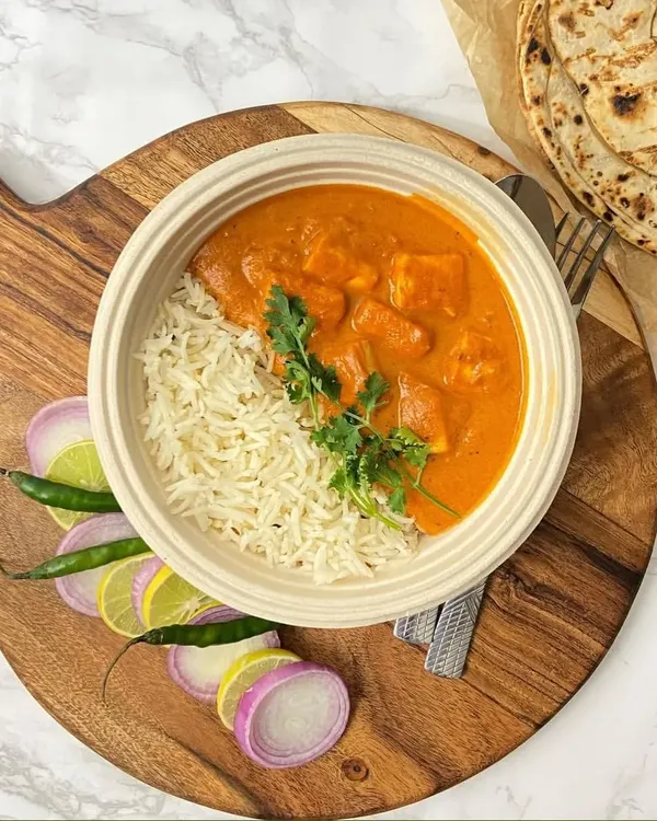 A perfect meal bowl of creamy Kadhai Paneer served with fluffy Jeera Rice. It's a complete and satisfying dinner, ready to be enjoyed.