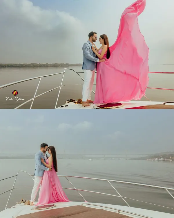 A stunning shot from Sahiba and Anshay's pre wedding shoot on a yacht in Goa. The bride's flowing pink dress creates a dramatic and romantic effect against the open water.