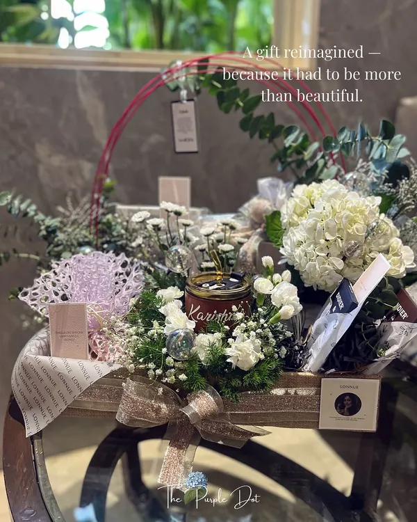 This gift was reimagined to be more than just beautiful; it had to tell a founder's story. It is a testament to my process, where I blend your vision with layers of texture, fresh hydrangeas, and personalized details until the gift feels true to the moment.