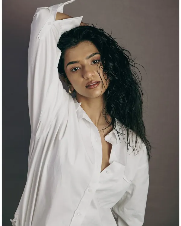 A fresh and natural studio portrait with a 'wet hair' look. This type of shot shows a model's raw beauty and is essential for any portfolio.