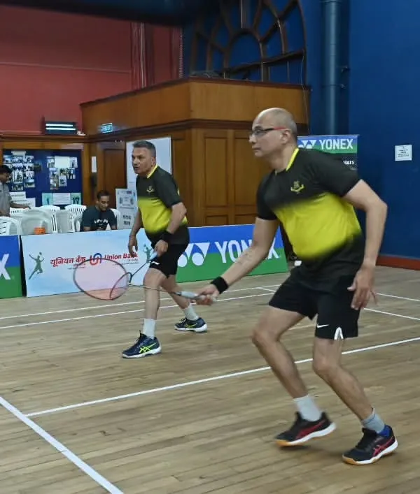 Two players in a doubles match during the GD Birla Masters Inter-Club Tournament. We organize competitive events for adults and veterans, focusing on high-quality gameplay and organization.