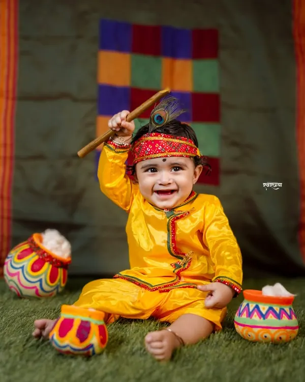 This is our natkhat Gopal, Rudra, whose infectious smile made my day. I love creating these vibrant, playful setups for Janmashtami, capturing the divine and mischievous spirit of Kanha in your little one. It’s a joy to bring these cultural stories to life.