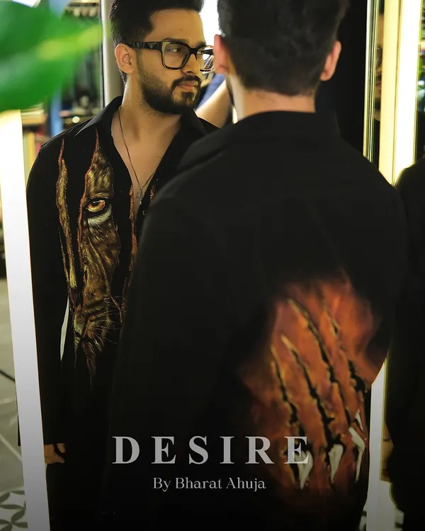 A reflection of inner strength. I designed this shirt with a dual-sided tiger motif, featuring a piercing eye on the front and claw marks on the back. It is a piece of wearable art for the man who is fierce from every angle.
