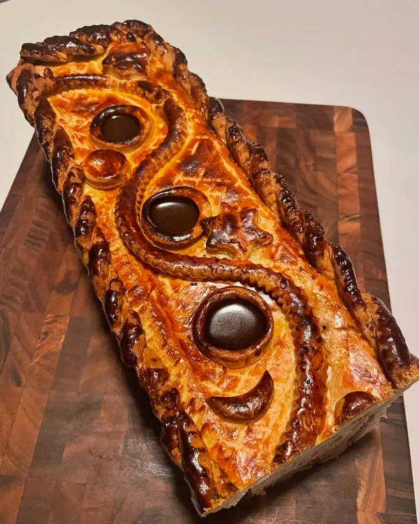 The top of my Pâté En Croute, showcasing the intricate pastry work and the rich, dark aspic set within the vents. This is a true labor of love.