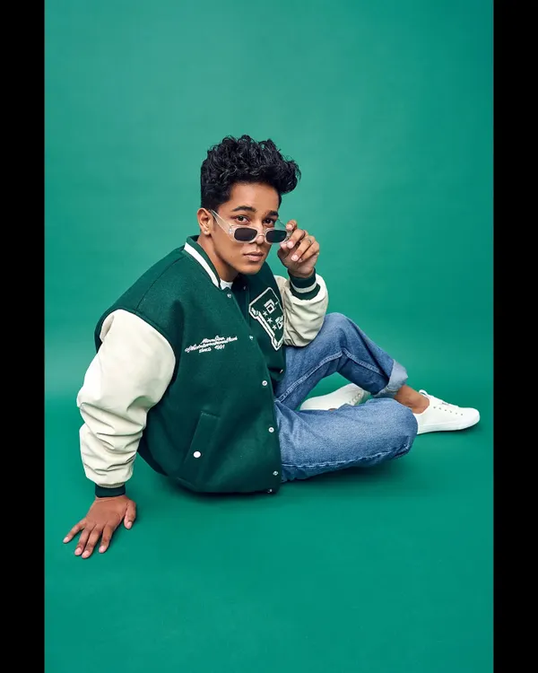 Styling for men is about capturing an attitude. For this model's portfolio, I created a cool, collegiate look with a classic varsity jacket, casual denim, and sleek sunglasses that feels both current and timeless.