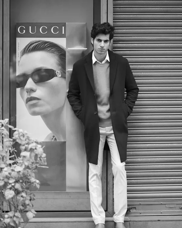 A black and white editorial shot capturing a high-fashion look on a city street. This style is perfect for creating a sophisticated and timeless brand campaign or a standout model portfolio.