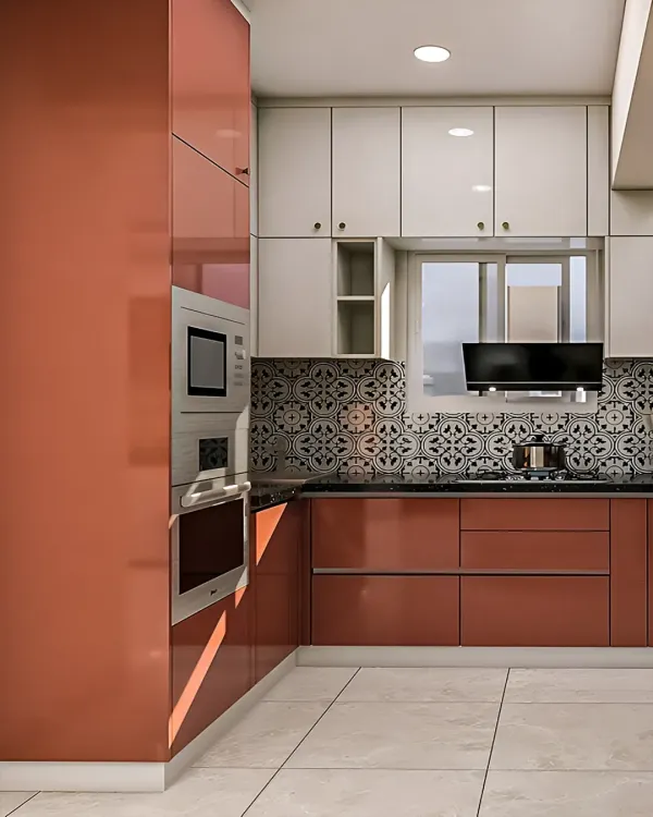 This L-shaped modular kitchen features a bold combination of glossy rust-orange and white cabinets. The patterned tile backsplash adds a decorative touch, while the built-in oven and microwave unit ensures a seamless and modern look.