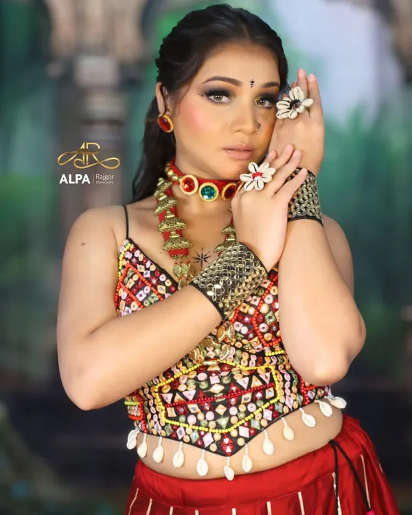 A close-up of the Navratri makeup, featuring a dramatic smokey eye, flawless skin, and traditional jewelry. This look is designed to be bold and expressive.