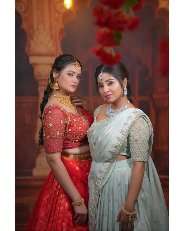 Planning a coordinated look with your bestie or sister? I offer beautiful hand-worked half sarees in complementary colors like this red and mint green, perfect for weddings and festive events.