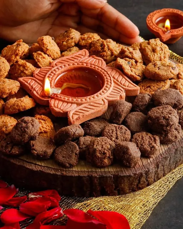 A beautiful Diwali-themed platter featuring healthy cookies and a traditional diya. This image combines festive elements with the product to create a perfect visual for holiday marketing.