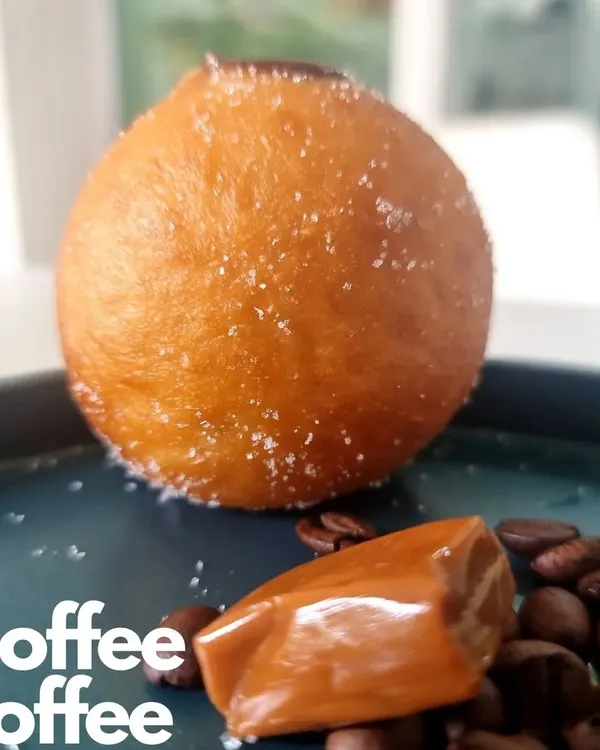 My Coffee Toffee Bomboloni is a treat for coffee lovers. The soft, sugar dusted doughnut is filled with a rich coffee cream, perfectly complementing the sweet toffee flavor.