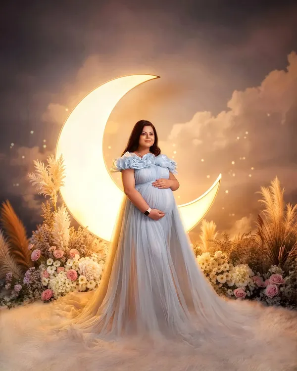 Feel like a queen in our Elsa gown. This dreamy, ice-blue tulle dress is perfect for creating a magical, celestial-themed maternity shoot, especially with our popular moon and clouds studio setup.