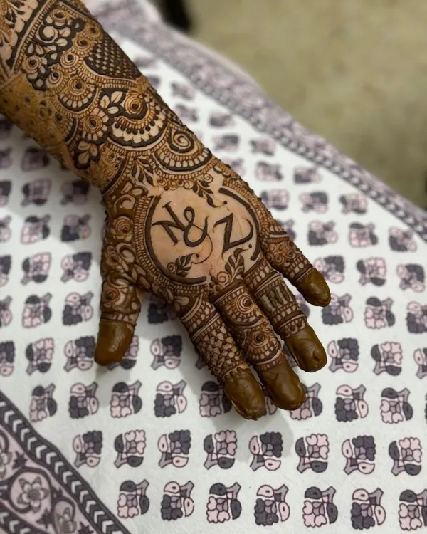 A beautiful way to personalize your mehendi. Here, I've designed a central motif with the couple's initials, 'N & Z', surrounded by traditional patterns.