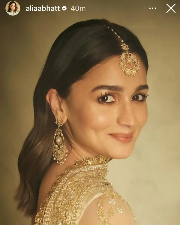 A beautiful shot of Alia Bhatt, her smile radiating warmth. She is wearing my handcrafted 18k gold filigree earrings and a matching maang tika, pieces designed to feel both traditional and timeless.